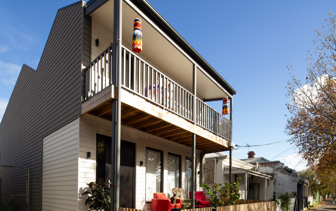 Front verandah of Passive House in heritage overlay receiving morning sun
